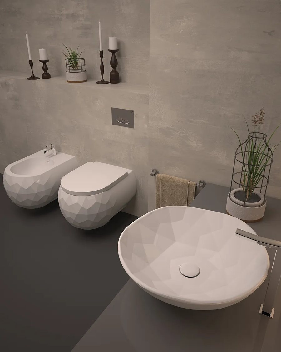 Beton görünümlü duvar önünde dokulu asma klozet, bide ve çanak lavabo takımı